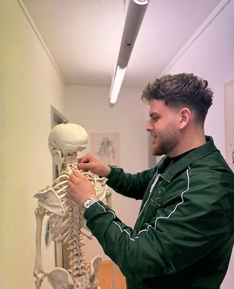 Man in green jacket examining a human skeleton model in a classroom setting